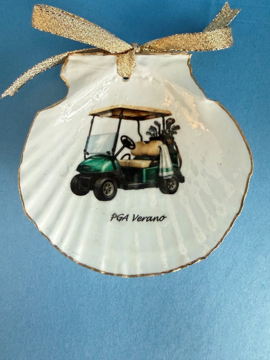 Gold-edged scallop shell with a green golf cart and the words PGA Verano